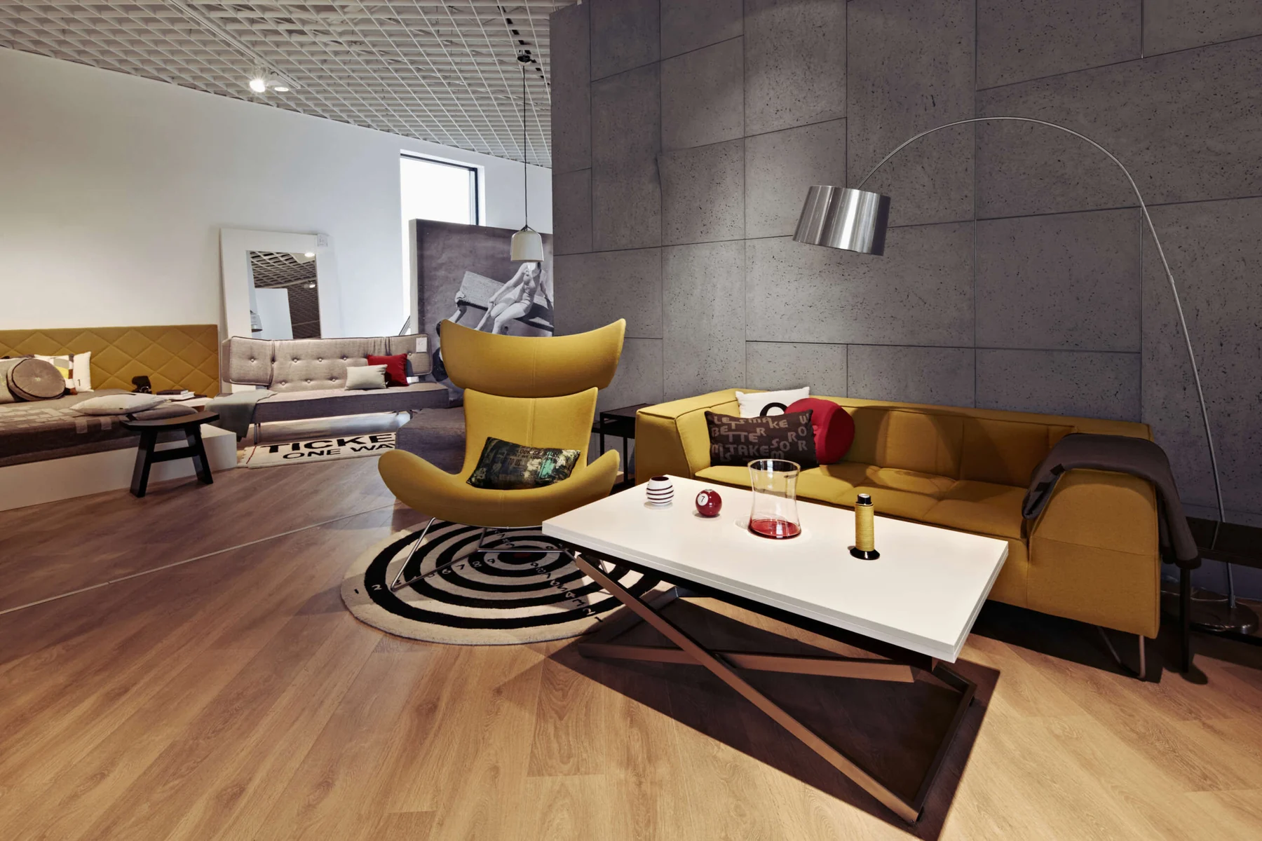 Dark concrete panel wall installation in a modern living room